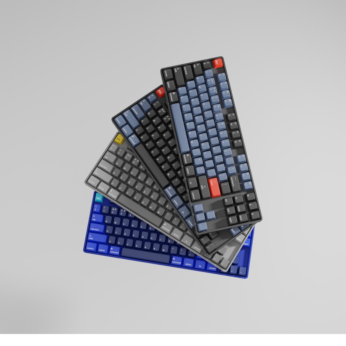 Keychron V3 keyboards in four colorways, fanned out on light gray.