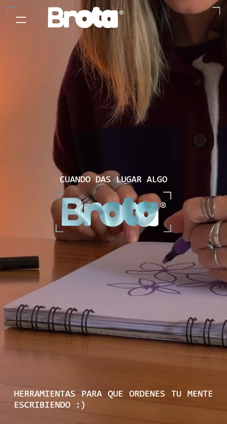 Brota home page on a phone: two hands with rings drawing flowers in a notebook, under the Brota logo.