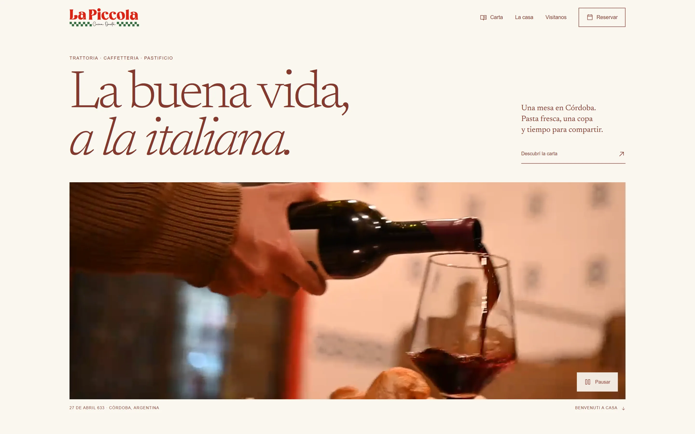 La Piccola home page on desktop: “La buena vida, a la italiana.” above a photo of red wine being poured.