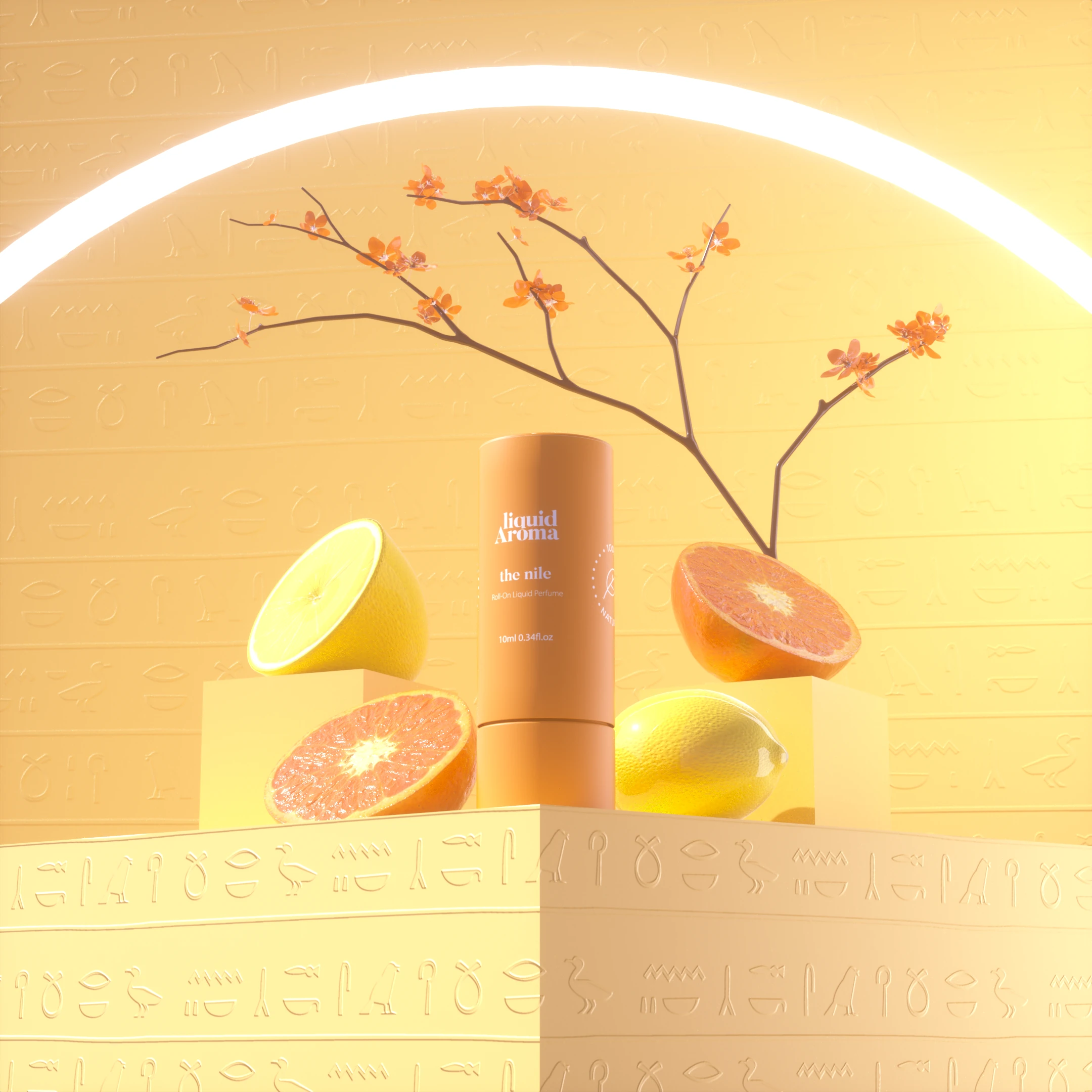 The orange The Nile tube on a pale yellow set carved with hieroglyphs, with citrus halves and a blossoming branch.