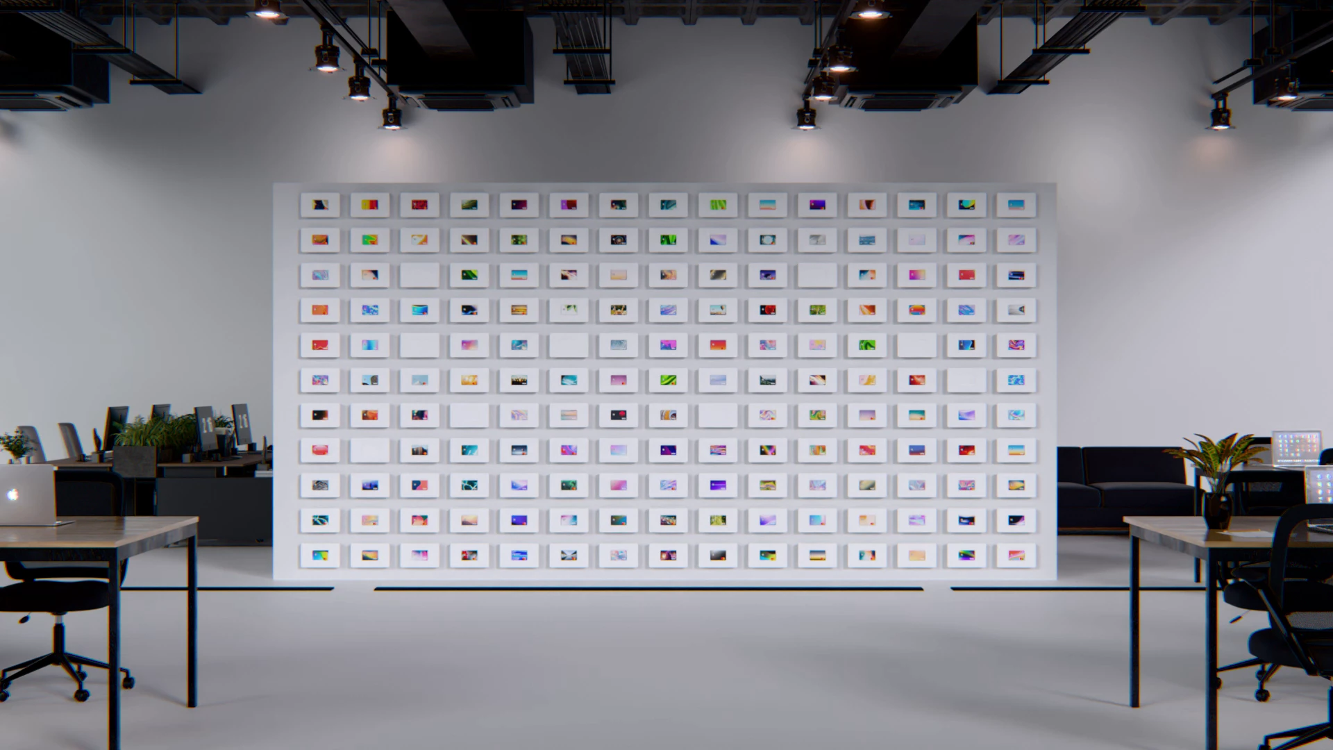 A white wall covered in payment cards, in an open-plan office.