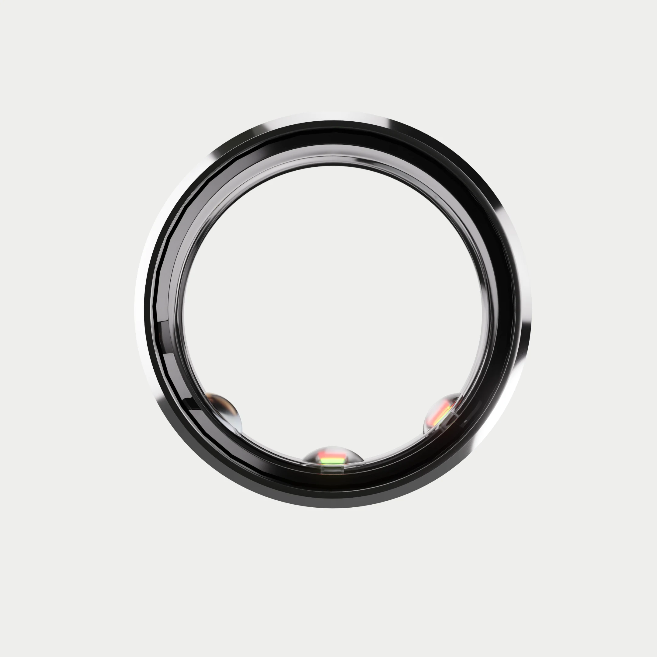 A Signal ring seen head-on, with three sensor domes on the inner band.
